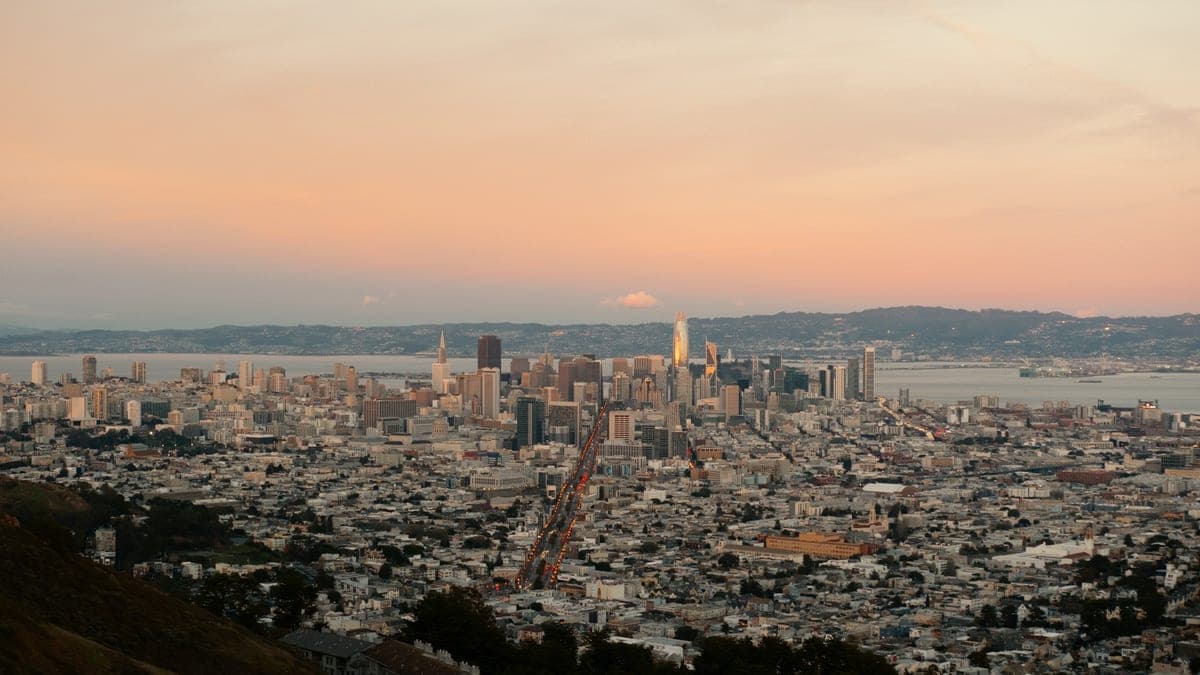 The San Francisco skyline at dusk with the bay in the background